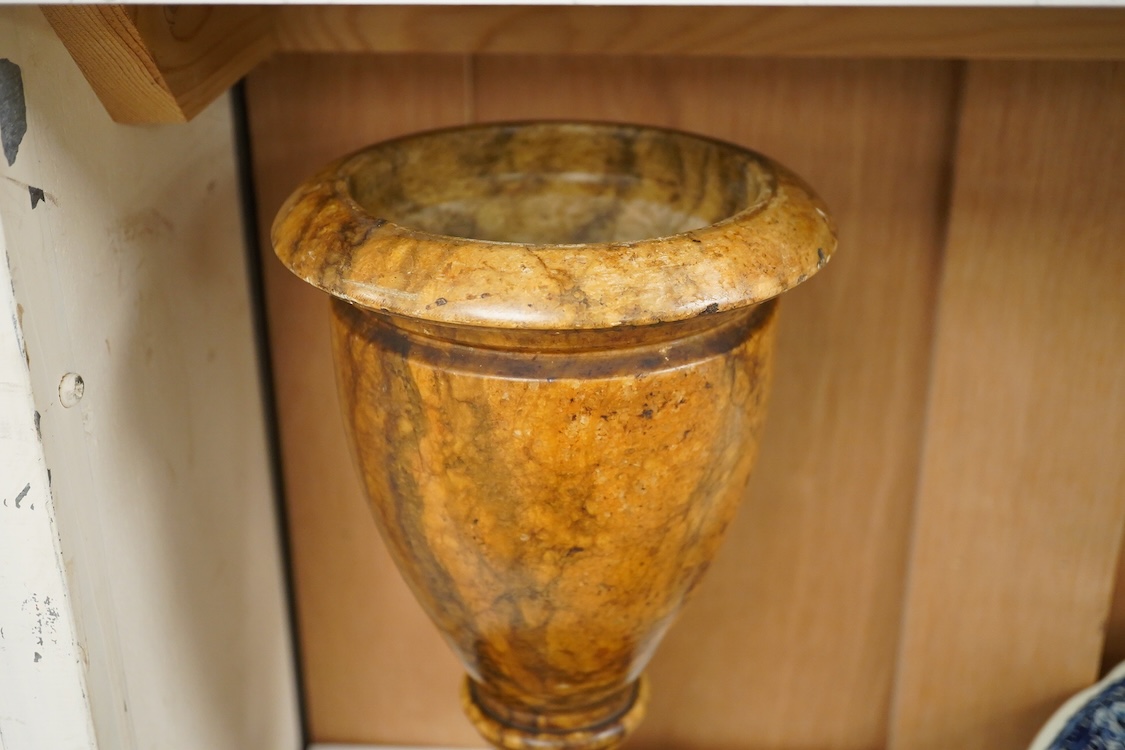 A 19th century Sienna marble urn on stand together with an English glass paperweight and Boch Delfts charger, 39cm